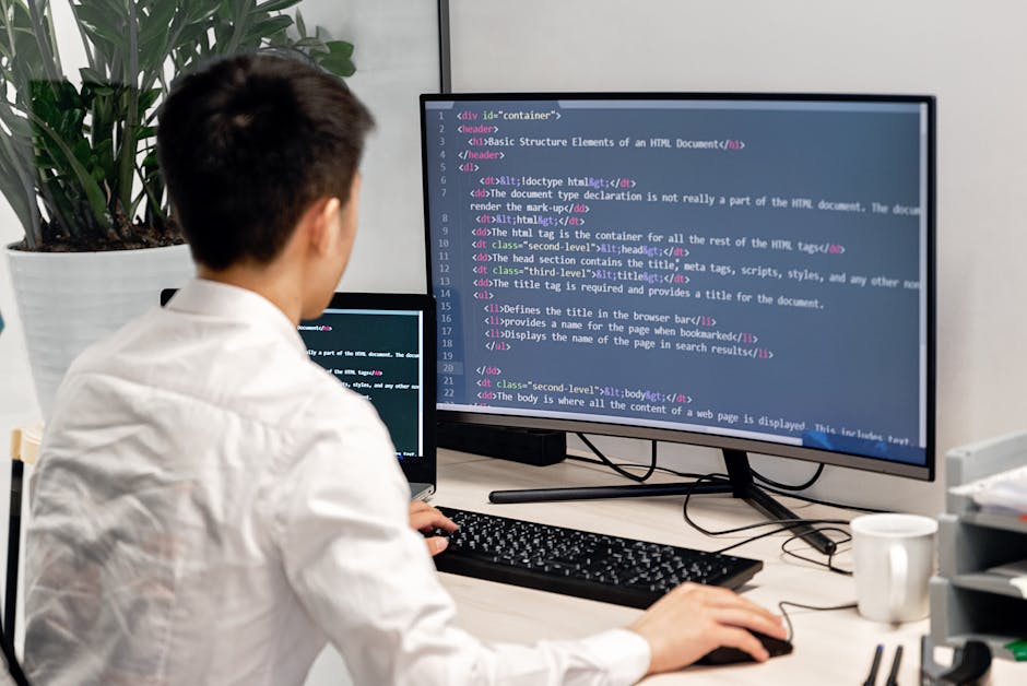 full-stack developer working dual monitors code 2026 office