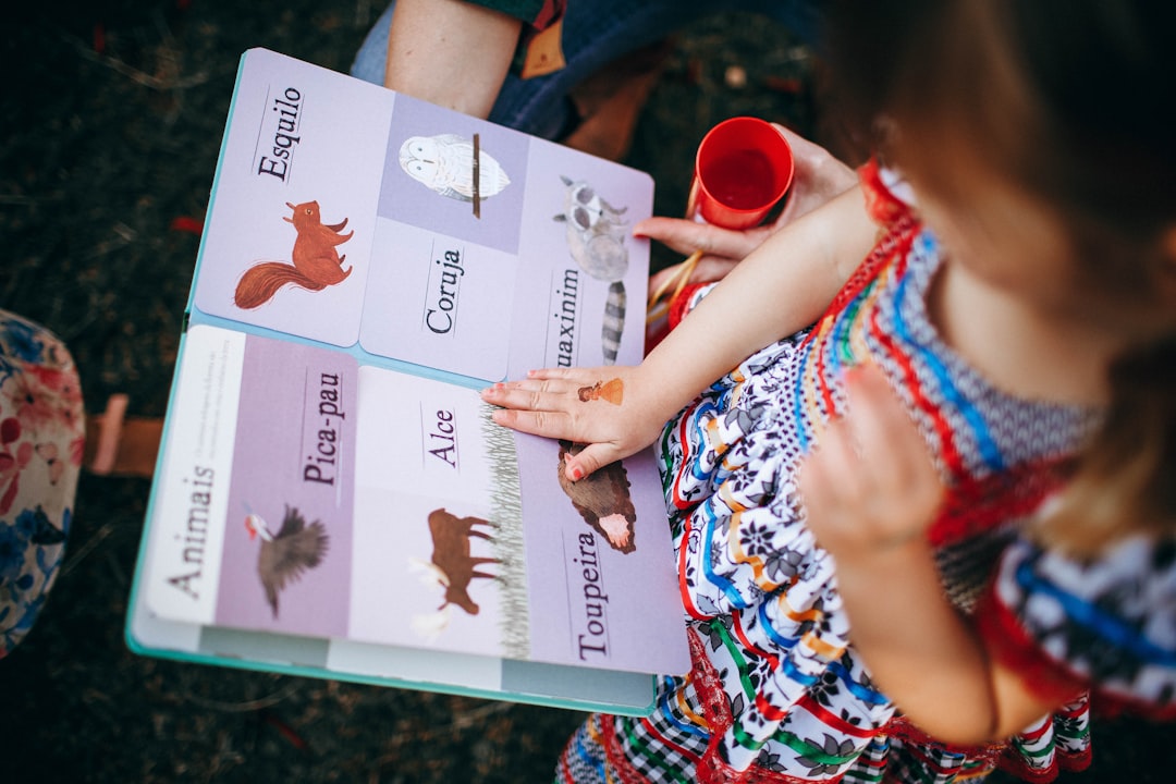 child reading english book, phonics learning